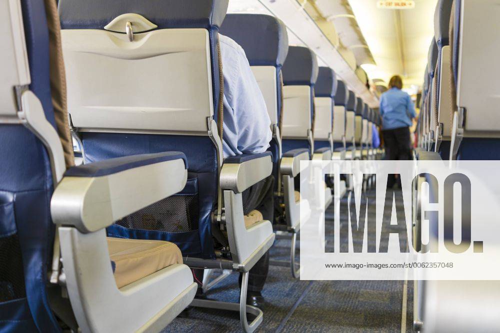 Commercial airplane interior with seats and aisle ABA001048