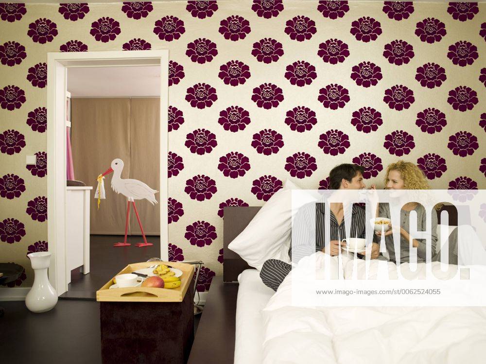 Young couple having breakfast in Bed model released property released WESTF06682