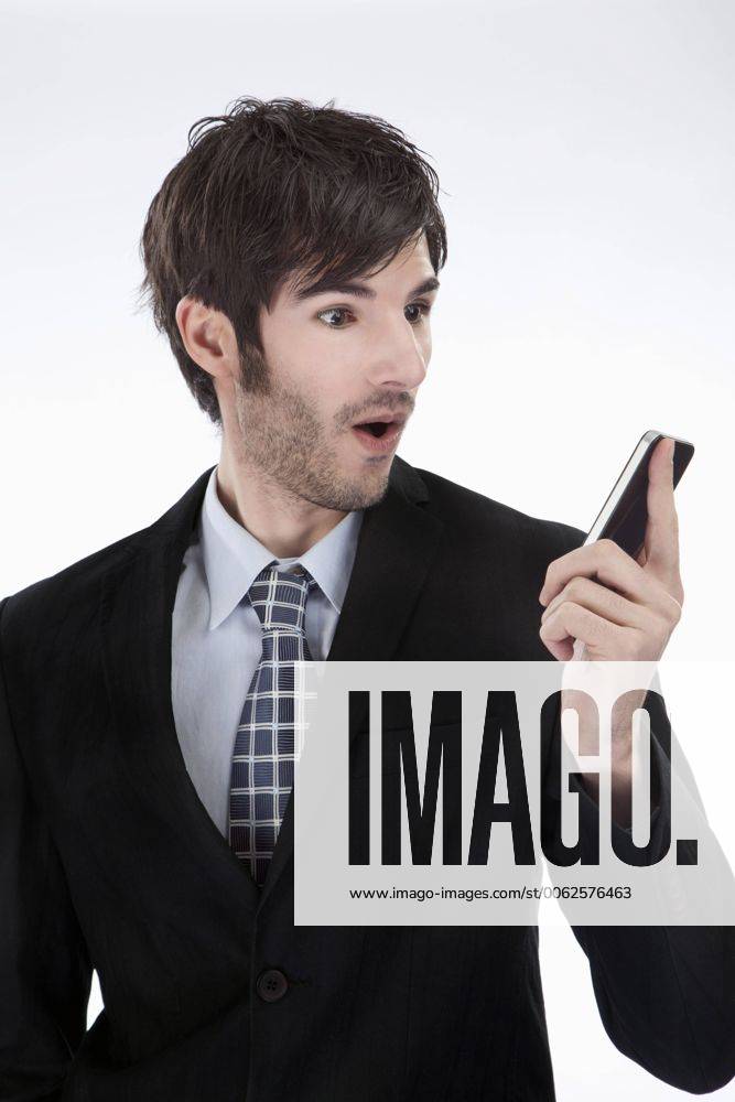 Businessman looking at cell phone model released MAEF004239