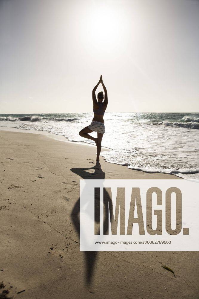 Caribbean, Barbados, Silver Sands beach, woman practicing yoga model released Symbolfoto SKF001563
