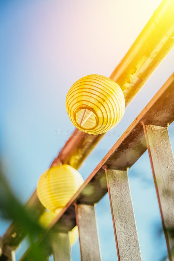 Summer feeling on the balcony: Close up of lampions, Close up of summer lampions on a balcony, leisure time in the summer holidays, light, feeling, party, outdoors, decoration, concept, lifestyle, garden, cosy, weekend, evening, relax, home, summertime, festival, homelike, ease, relaxation, bright, celebration, youth, season, object, invitation, music, fun, lighting, design, celebrate, decorative, vintage, colors, text, space, carnival, copy, sphere