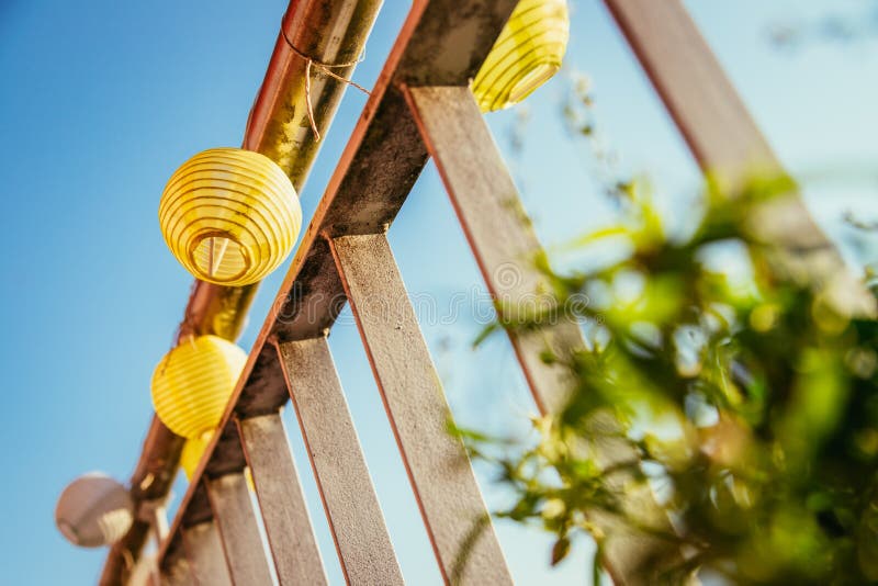 Summer feeling on the balcony: Close up of lampions, Close up of summer lampions on a balcony, leisure time in the summer holidays, light, feeling, party, outdoors, decoration, concept, lifestyle, garden, cosy, weekend, evening, relax, home, summertime, festival, homelike, ease, relaxation, bright, celebration, youth, season, object, invitation, music, fun, lighting, design, celebrate, decorative, vintage, colors, text, space, carnival, copy, sphere