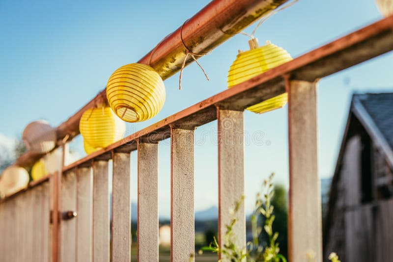 Summer feeling on the balcony: Close up of lampions, Close up of summer lampions on a balcony, leisure time in the summer holidays, light, feeling, party, outdoors, decoration, concept, lifestyle, garden, cosy, weekend, evening, relax, home, summertime, festival, homelike, ease, relaxation, bright, celebration, youth, season, object, invitation, music, fun, lighting, design, celebrate, decorative, vintage, colors, text, space, carnival, copy, sphere