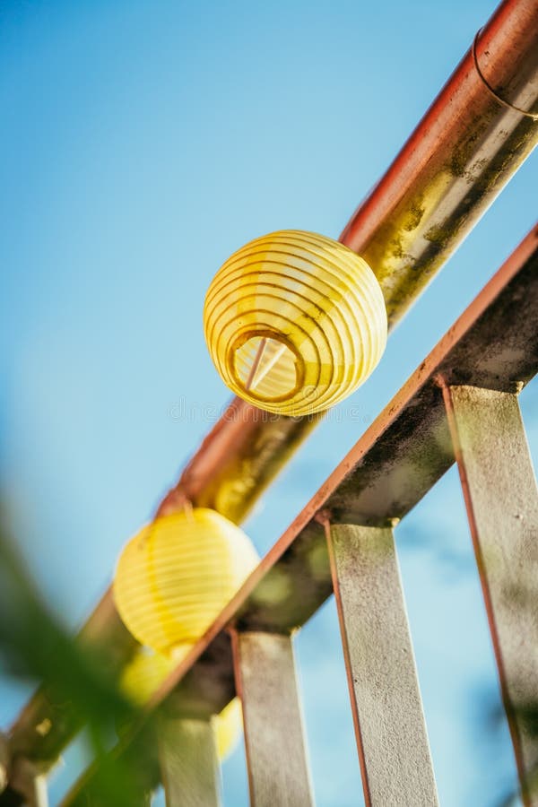 Summer feeling on the balcony: Close up of lampions, Close up of summer lampions on a balcony, leisure time in the summer holidays, light, feeling, party, outdoors, decoration, concept, lifestyle, garden, cosy, weekend, evening, relax, home, summertime, festival, homelike, ease, relaxation, bright, celebration, youth, season, object, invitation, music, fun, lighting, design, celebrate, decorative, vintage, colors, text, space, carnival, copy, sphere
