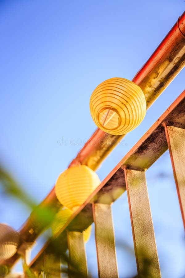 Summer feeling on the balcony: Close up of lampions, Close up of summer lampions on a balcony, leisure time in the summer holidays, light, feeling, party, outdoors, decoration, concept, lifestyle, garden, cosy, weekend, evening, relax, home, summertime, festival, homelike, ease, relaxation, bright, celebration, youth, season, object, invitation, music, fun, lighting, design, celebrate, decorative, vintage, colors, text, space, carnival, copy, sphere