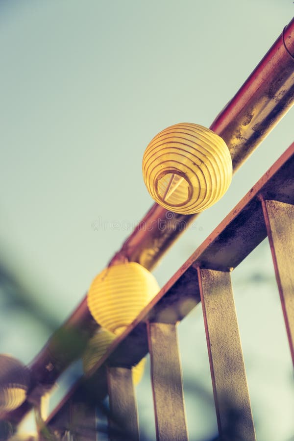 Summer feeling on the balcony: Close up of lampions, Close up of summer lampions on a balcony, leisure time in the summer holidays, light, feeling, party, outdoors, decoration, concept, lifestyle, garden, cosy, weekend, evening, relax, home, summertime, festival, homelike, ease, relaxation, bright, celebration, youth, season, object, invitation, music, fun, lighting, design, celebrate, decorative, vintage, colors, text, space, carnival, copy, sphere