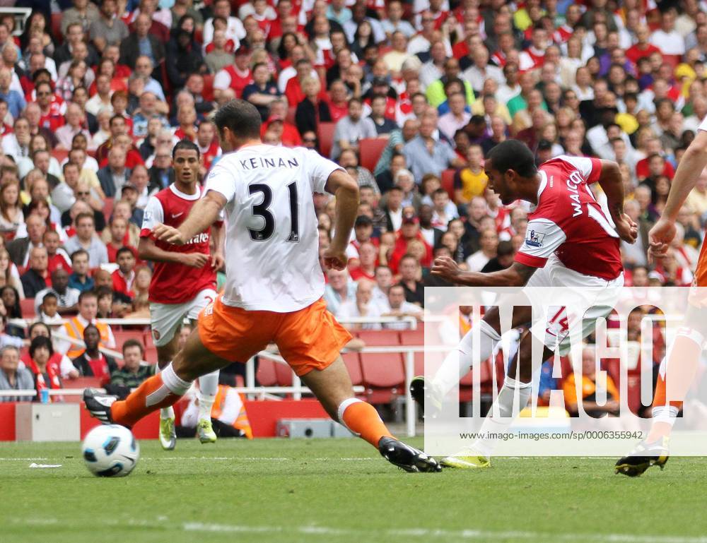 Arsenal s Theo Walcott scoring his sides second goal Barclays Premier League Arsenal London (red) v Blackpool FC (white) 21st August, 2010 .
