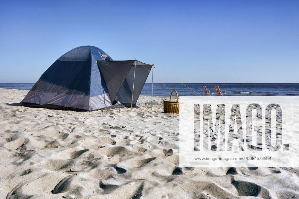 Estonia, two folding chairs, wicker basket and a tent on Kauksi beach at Lake Peipus JAAF000145