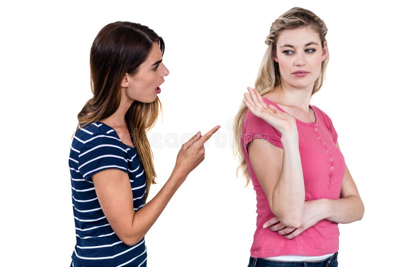 Female friends arguing, Female friends arguing while standing over white background