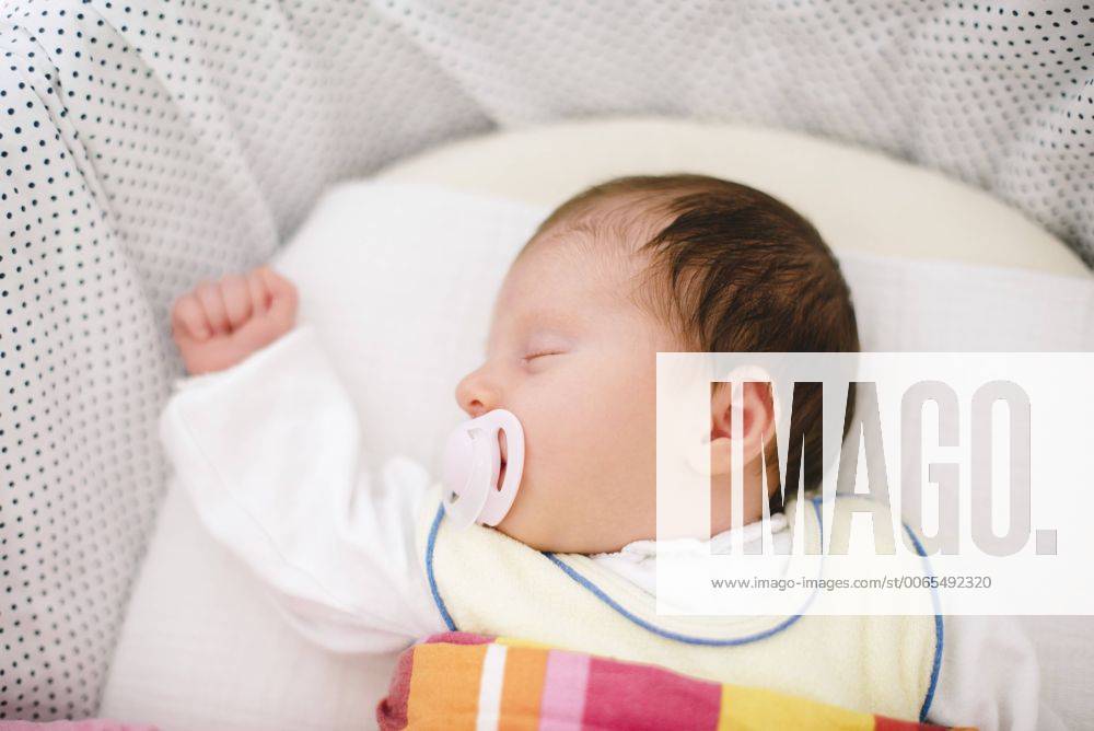 Sleeping newborn baby girl with pacifier model released Symbolfoto BRF001233