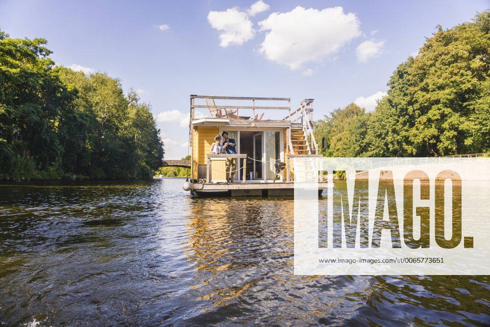 Couple having a trip on a house boat model released Symbolfoto property released FMKF001902