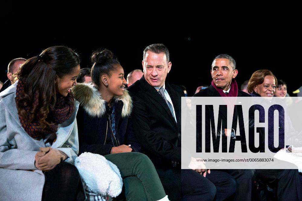 Dec. 4, 2014 - Washington, DC, United States of America - Actor Tom Hanks jokes with Malia and Sasha as President Barack Obama looks on at the National Christmas Tree lighting ceremony on the Ellipse December 4, 2014 in Washington, D.C. Washington United States of America - ZUMAp138