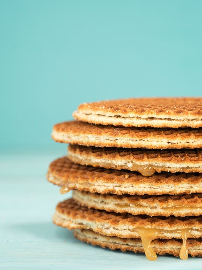Stroopwafels or caramel Dutch Waffles, Stroopwafels or caramel Dutch Waffle close up on turquoise wooden background