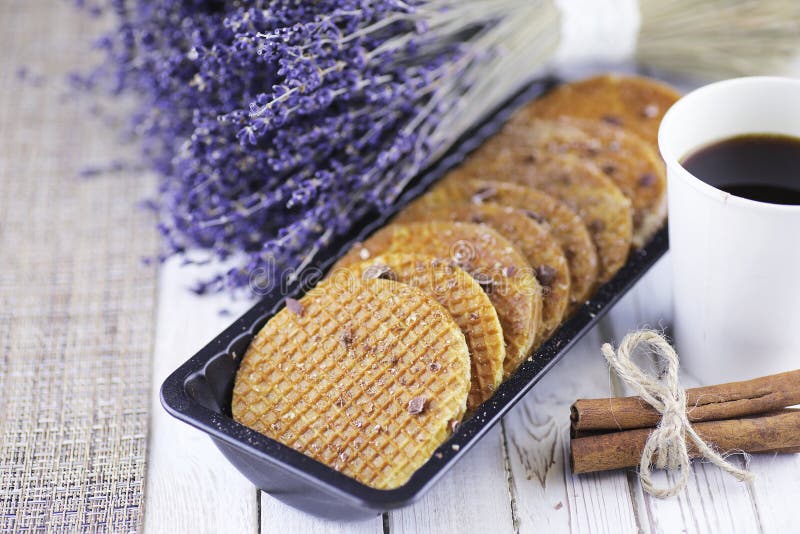 Viennese wafers with caramel on a wooden background, Viennese wafers with caramel on a wooden white backgroundr