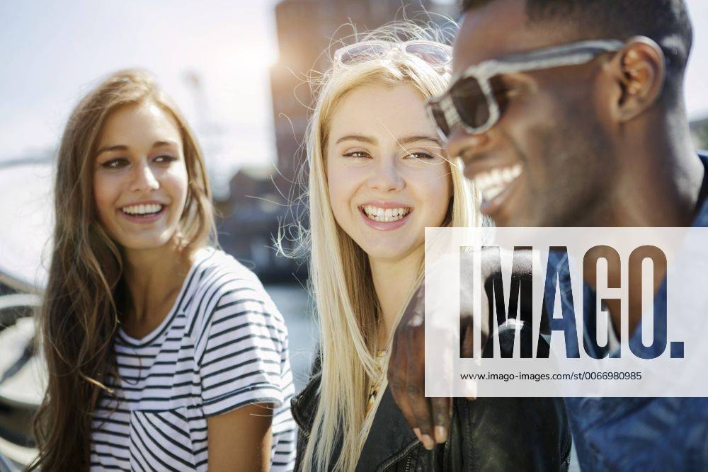 Germany, Duisburg, three young people having fun at Media Harbour GDF000881