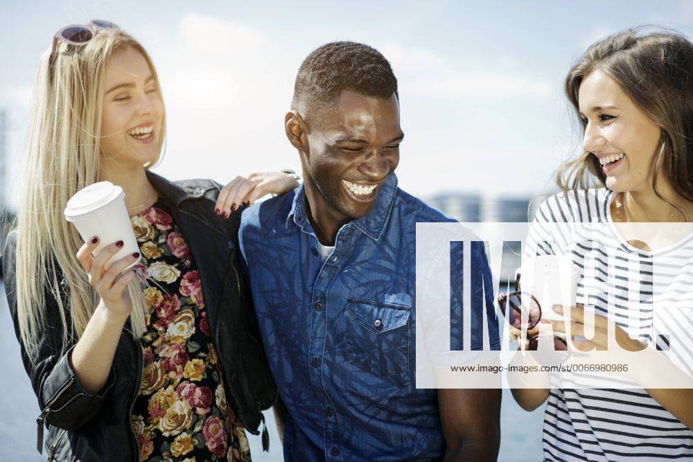 Germany, Duisburg, three young people having fun at Media Harbour GDF000882