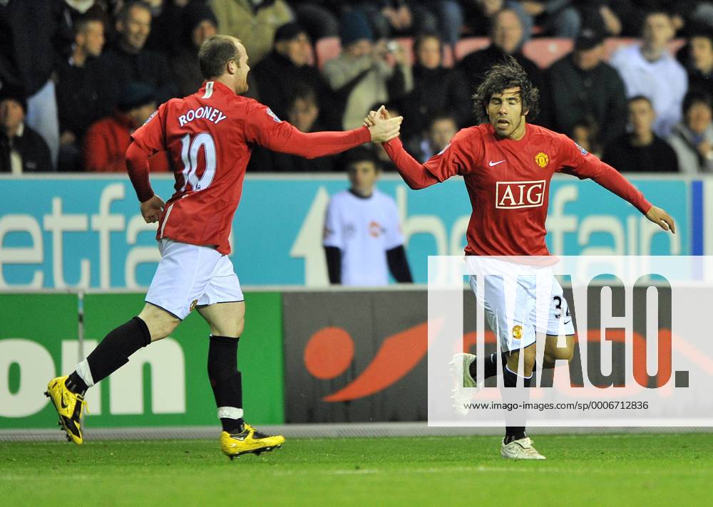 Manchester United s Carlos Tevez (R) celebrates his goal with Wayne Rooney - Wigan Athletic vs Manchester United Barclays Premiership -