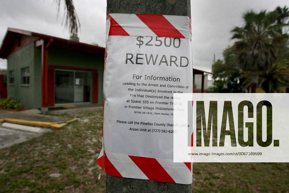 Palm Harbor, Florida, U.S. - DOUGLAS R. CLIFFORD.Detectives with the Pinellas County Sheriff s Office arson auto theft unit posted this sign this week in the Frontier Village Mobile Home Park in Palm Harbor looking for information leading to the arrest and conviction of the individual(s) involved in the fire that destroyed the home at unit 105 in the park. - ZUMAs70