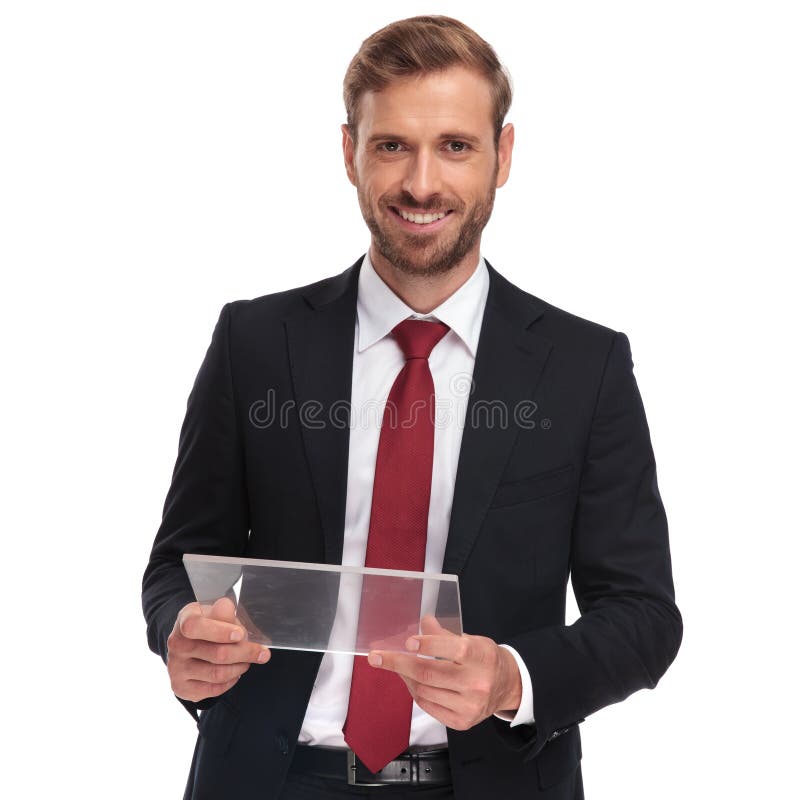 Portrait of smiling businessman holding a futuristic tablet, Portrait of smiling businessman holding a futuristic transparent tablet while standing on white background model released