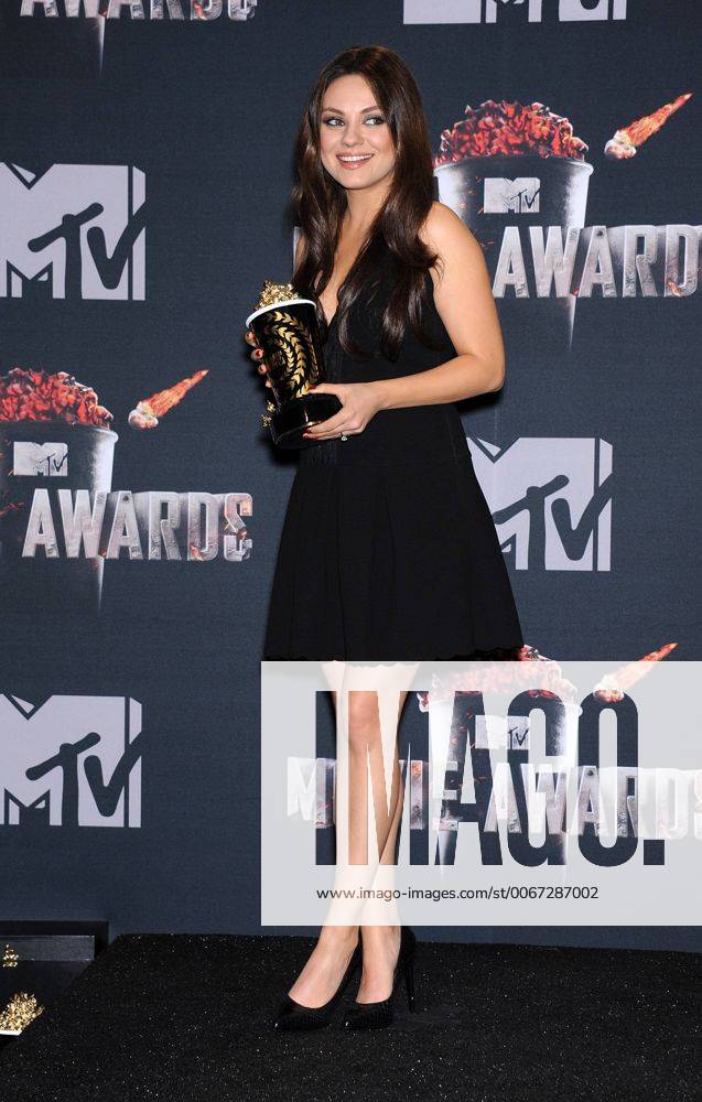 Los Angeles, California, U.S. - Mila Kunis in the press room at the 2014 Mtv Movie Awards at the Nokia theater. - ZUMAo05