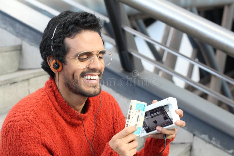 Ethnic guy using a walkman, Ethnic guy using a walkman. model released