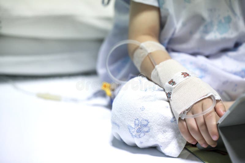 Sick child on a receiving a saline solution in hospital, Sick child on a receiving a saline solution in hospital.