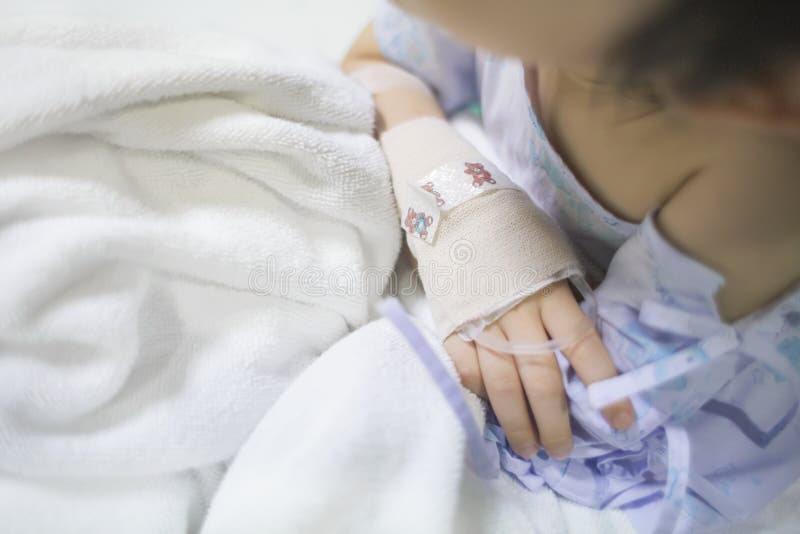 Sick child on a receiving a saline solution in hospital, Sick child on a receiving a saline solution in hospital.