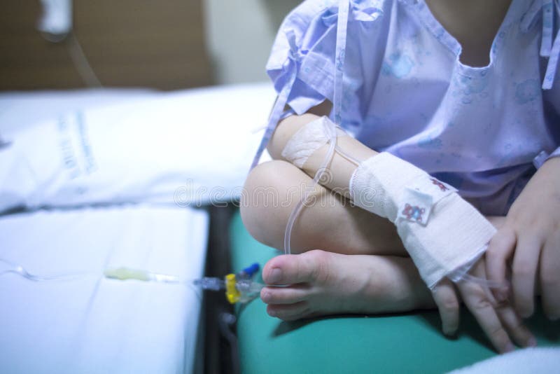 Sick child on a receiving a saline solution in hospital, Sick child on a receiving a saline solution in hospital.