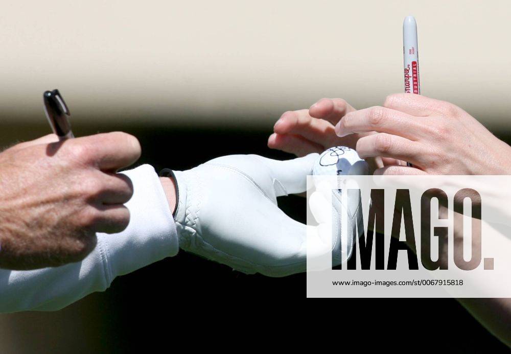 Palm Harbor, Florida, U.S. - DOUGLAS R. CLIFFORD TIMES.Jim Furyk, left, hands a signed golf ball to a fan at the 16th tee Wednesday (3 13 13) while competing in the Tampa Bay Championship Pro-Am at Innisbrook s Copperhead Golf Course in Palm Harbor. - ZUMAs70