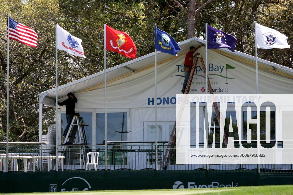 Palm Harbor, Florida, U.S. - DOUGLAS R. CLIFFORD TIMES.Flags representing branches of the United States military fly over the green at the 16th hole, set up to honor those serving in the military Wednesday (3 13 13) for the Tampa Bay Championship Pro-Am at Innisbrook s Copperhead Golf Course in Palm Harbor. - ZUMAs70