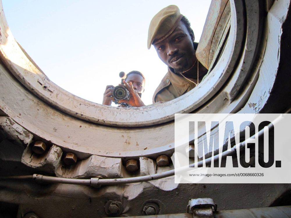 Dec. 12, 2012 - SDN - Yassin Hassen, a reporter for Nuba Reports, a website started by American Ryan Boyette, films inside a tank captured by rebels in Sudan s Nuba Mountains. - ZUMAm67_