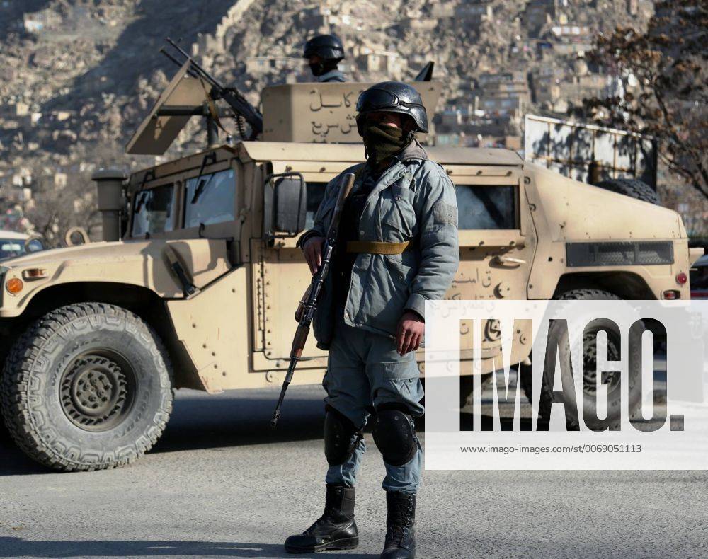 (160201) -- KABUL, Feb. 1, 2016 -- An Afghan security force member stands guard at the site of a suicide attack in Kabul, Afghanistan, Feb. 1, 2016. At least 10 people were killed and 20 others injured as a suicide bombing hit police headquarters in Kabul on Monday. )(dh) AFGHANISTAN-KABUL-SUICIDE ATTACK RahmatxAlizadah