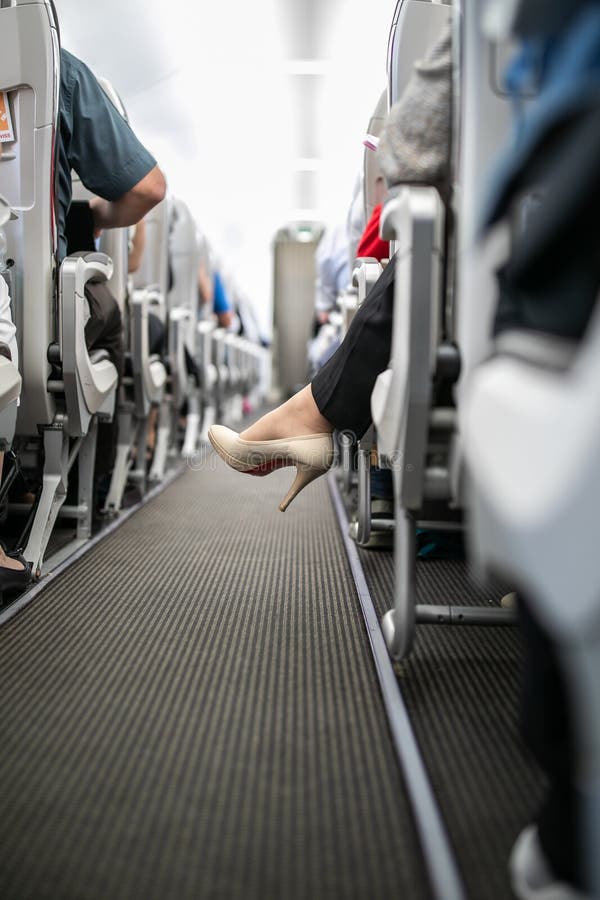Interior of commercial airplane with passengers, Interior of commercial airplane with passengers in their seats during flight