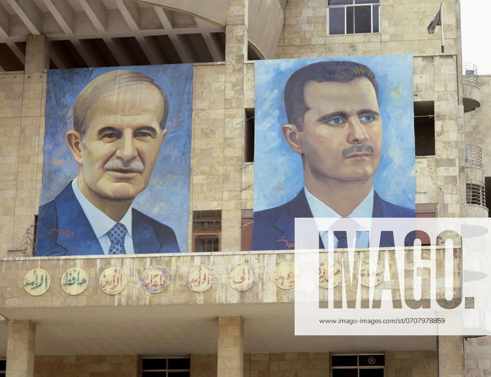 Presidents of Syria. Left: Hafez al-Asad (1930-2000), right: Basahr al-Assad (1965). Large portraits, Damascus, Syria. Presidents of Syria. Left: Hafez al-Asad (1930-2000), right: Basahr al-Assad (1965). Large portraits. Hamidie souk. Damascus. Picture took before the Civil War. Damascus Syria