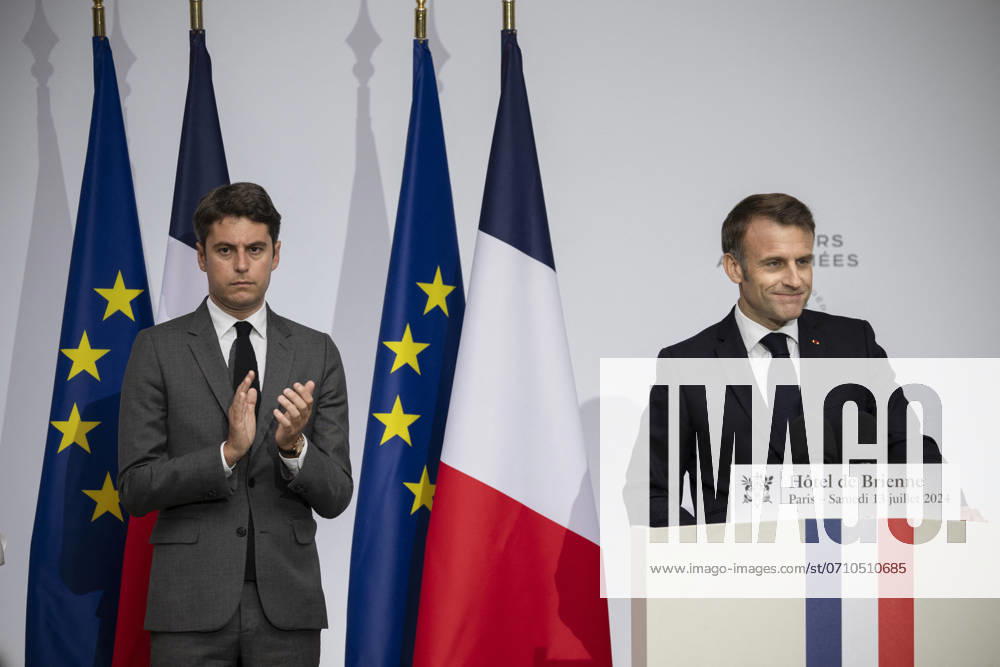 Emmanuel Macron during reception at Hotel de Brienne for Bastille Day Parade - Paris French President Emmanuel Macron and French Prime Minister Gabriel Attal look at the Hotel de Brienne, in Paris, on July 13, 2024, ahead of the annual Bastille Day parade on July 14. Photo by Eliot Blondet ABACAPRESS.COM Paris France
