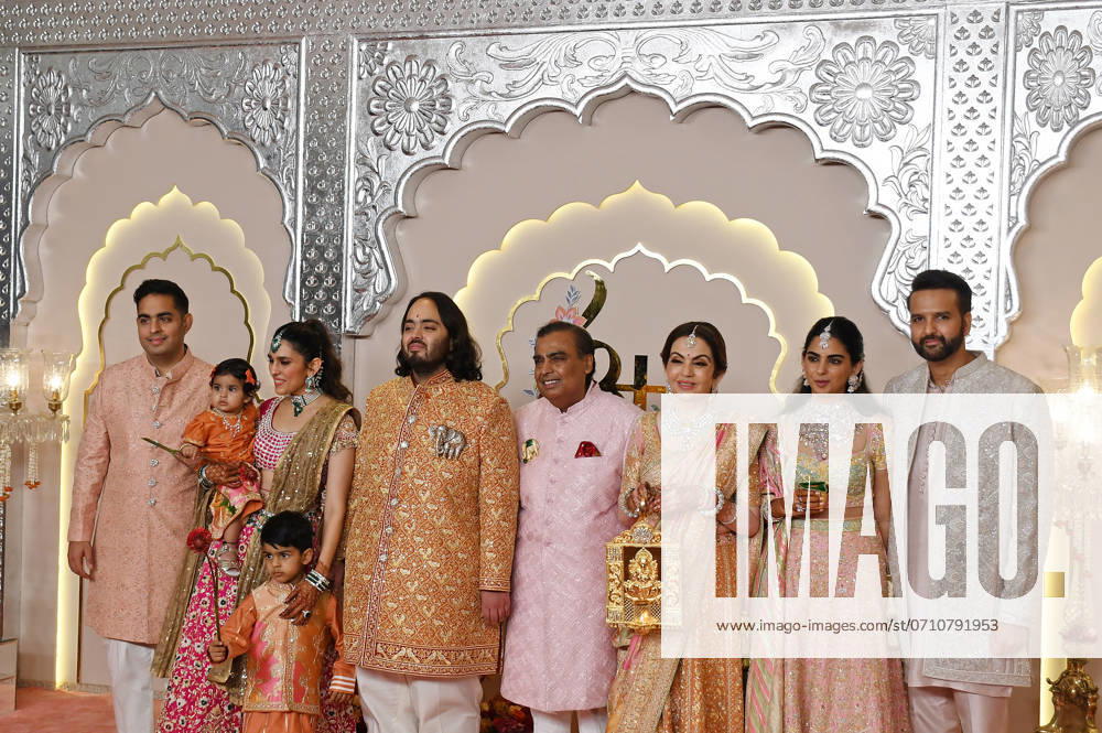 Wedding red carpet of Anant Ambani & Radhika Merchant in Mumbai, India - 12 Jul 2024 L-R Akash Ambani (son of Indian businessman Mukesh Ambani), Shloka Mehta, Anant Ambani (son of Indian businessman Mukesh Ambani), Indian businessman Mukesh Ambani, Nita Ambani, Isha Ambani (daughter of Indian businessman Mukesh Ambani) and Anand Piramal (executive director of Piramal group) pose for a photo on the red carpet wedding ceremony of Anant Ambani and Radhika Merchant in Mumbai. Mumbai India