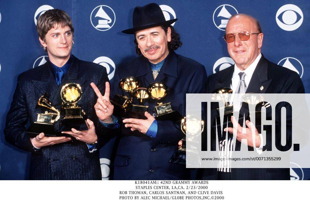 Jan. 1, 2011 - K18041AM:: 42ND GRAMMY AWARDS.STAPLES CENTER, LA,CA. 2 23 2000.ROB THOMAN, CARLOS SANTNAN, AND CLIVE DAVIS . ALEC MICHAEL GL0BE 2000 - ZUMAg49_