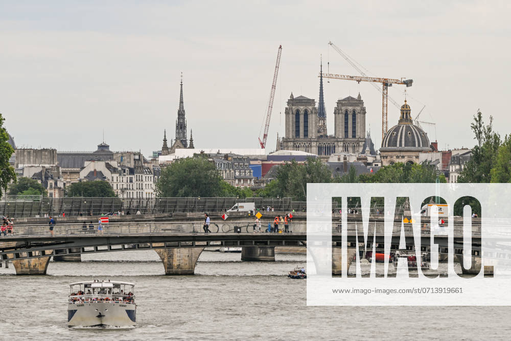 Daily Life In Paris On The Eve Of The Olympics PARIS, FRANCE - JULY 15: General view of central Paris, featuring the Seine River, boats, bridges, and Notre-Dame in the background, on July 15, 2024, in Paris France. Paris France