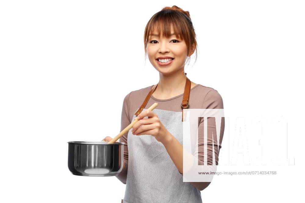 Culinary and people concept - happy smiling female chef in jacket with saucepan cooking food over white background. happy smiling female chef with saucepan ,model released, Symbolfoto