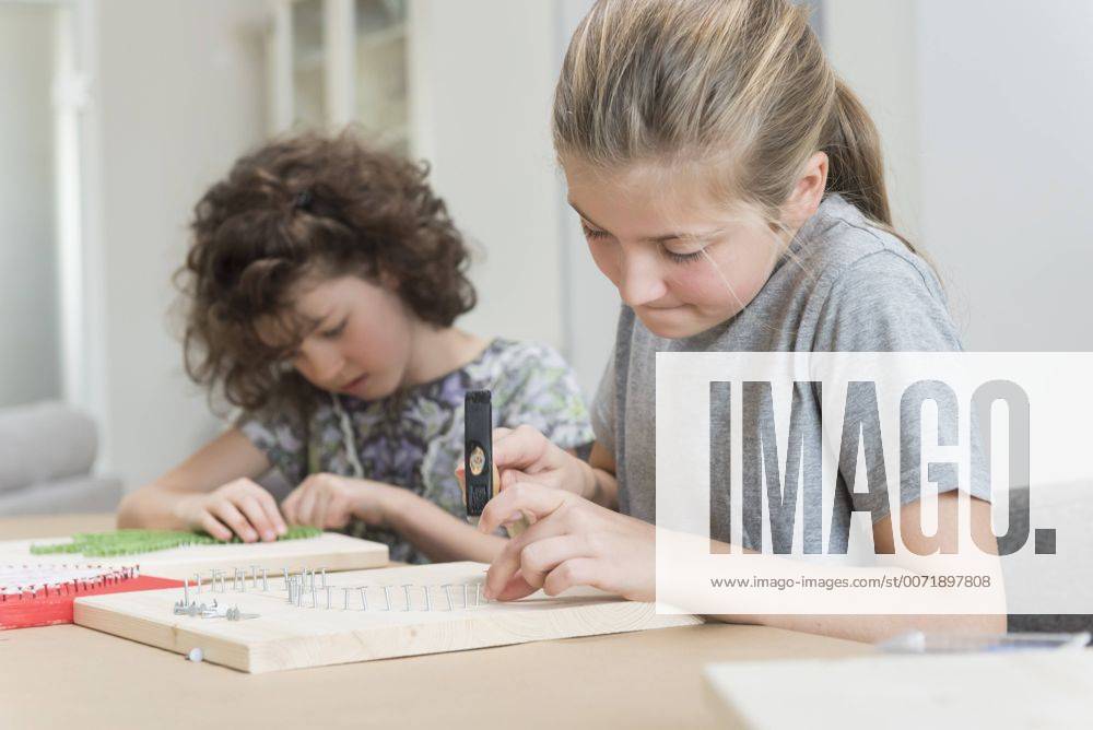 Two girls making nail images model released Symbolfoto property released NHF001520