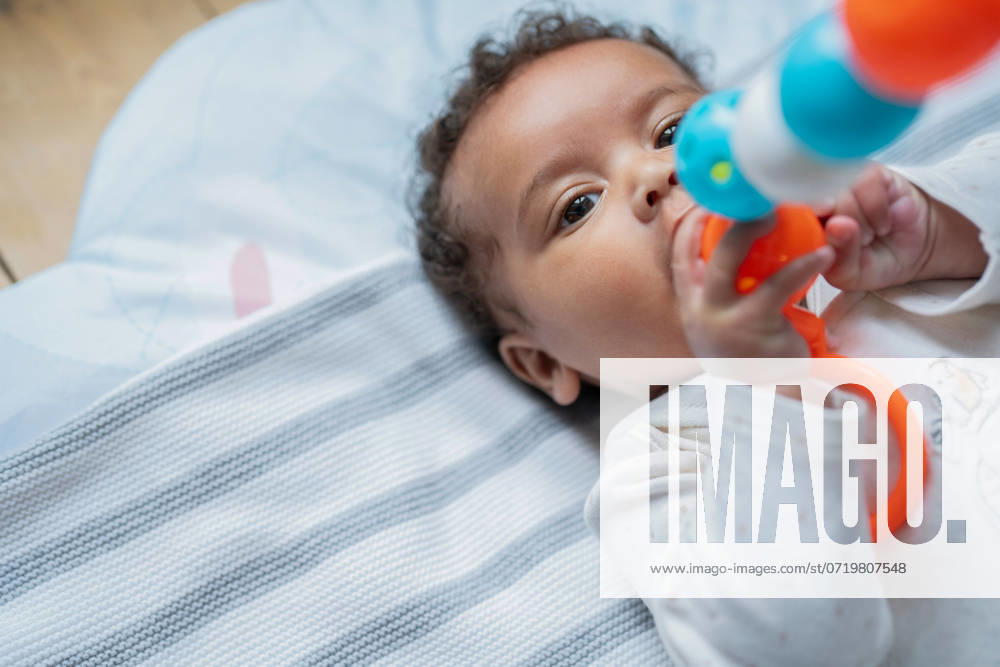 Baby girl holding toy model released