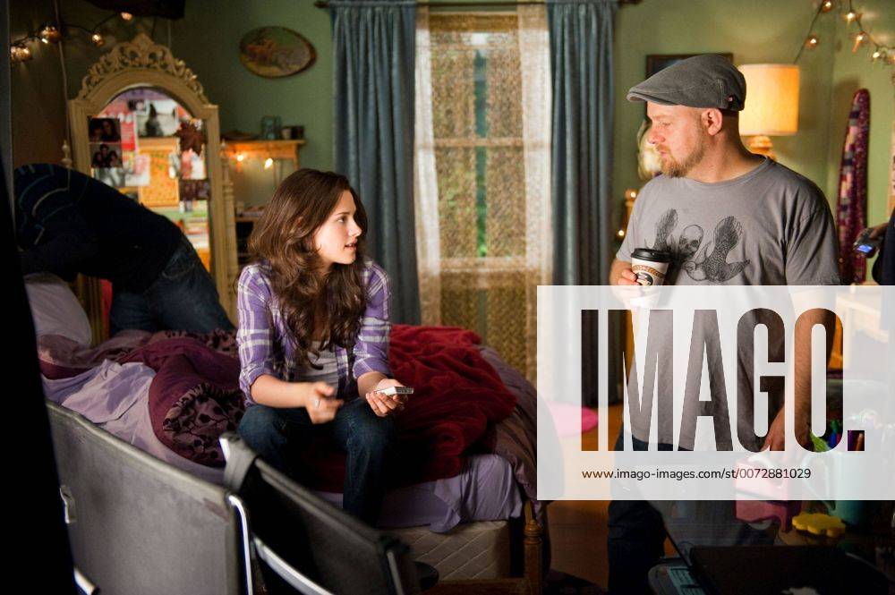 RELEASE DATE: June 30, 2010. MOVIE TITLE: The Twilight Saga: Eclipse. STUDIO: Summit Entertainment. PLOT: As a string of mysterious killings grips Seattle, Bella, whose high school graduation is fast approaching, is forced to choose between her love for vampire Edward and her friendship with werewolf Jacob. PICTURED: KRISTEN STEWART as Bella Swan and Director DAVID SLADE. - ZUMAg90_