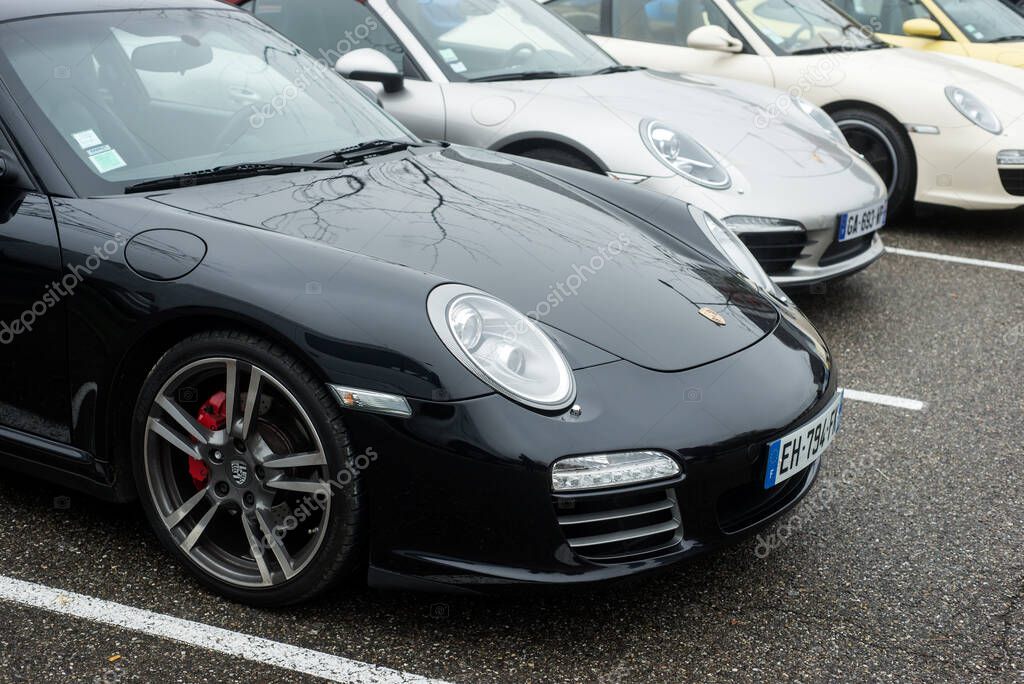 Mulhouse - France - 10 November 2022 - front view of black Porsche 911 turbo parked in the street