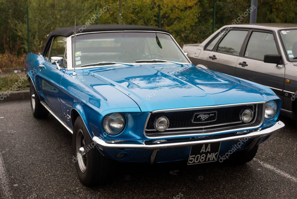 Mulhouse - France - 10 November 2022 - Front view of blue Ford Mustang 1967 parked in the street