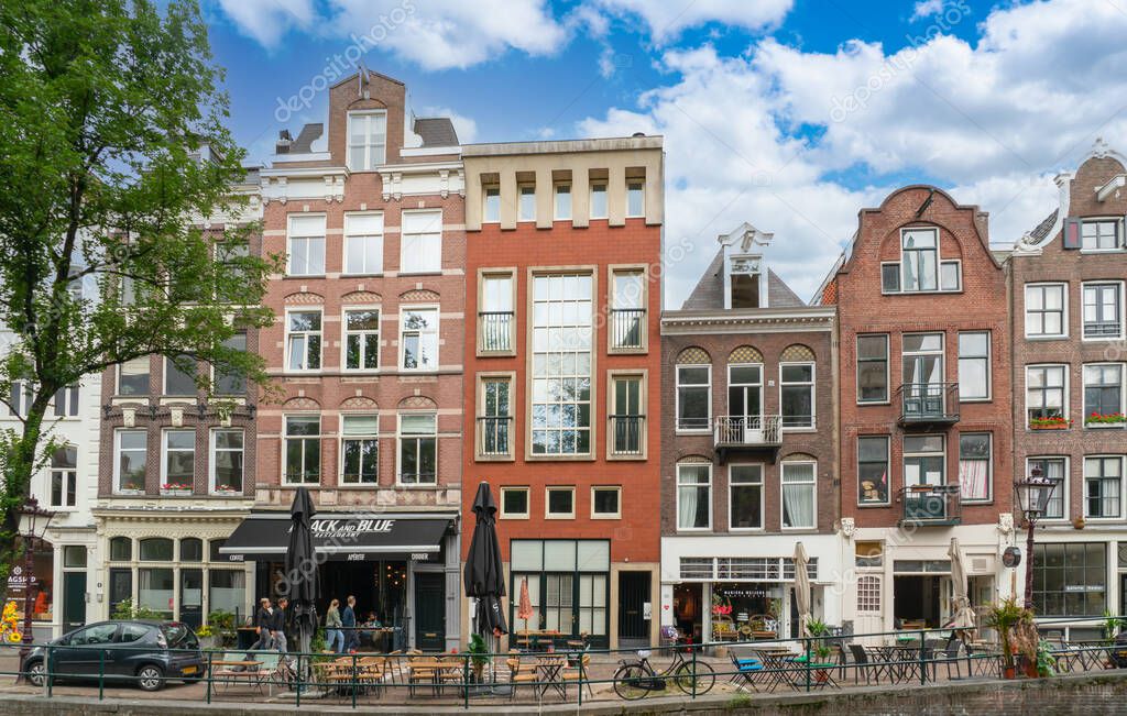 Amsterdam, The Netherlands - 6th august 2021 - Row of authentic canal houses on the small Leliegracht (Canal) in the center of Amsterdam
