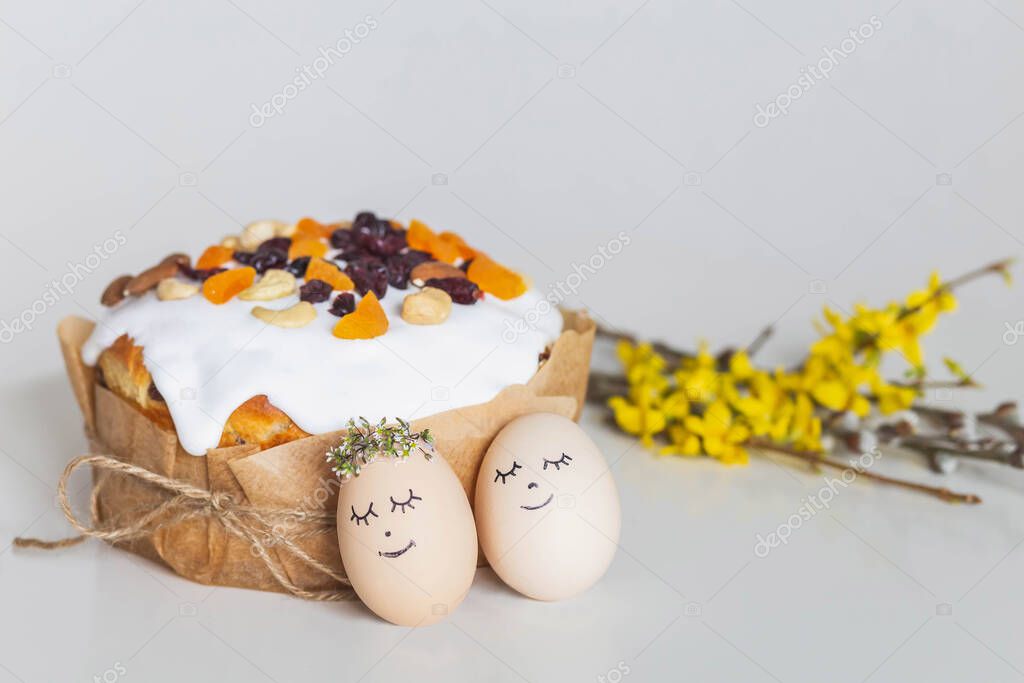 Easter cake, eggs and flowers. Focus in the foreground