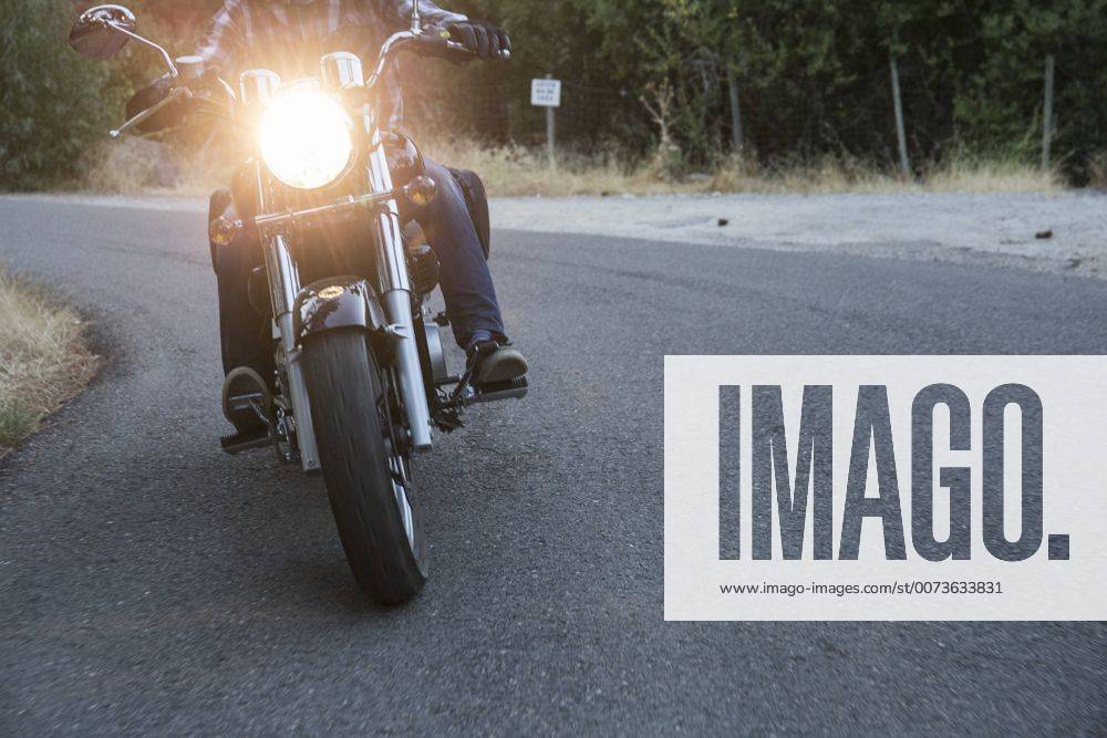 Man riding motorbike on country road model released Symbolfoto ABZF001156