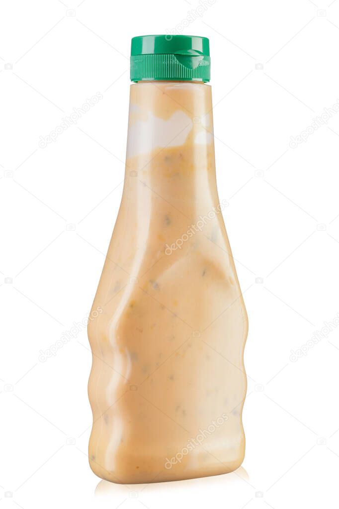 White sauce for chicken in a bottle. Isolated on white background. File contains clipping path