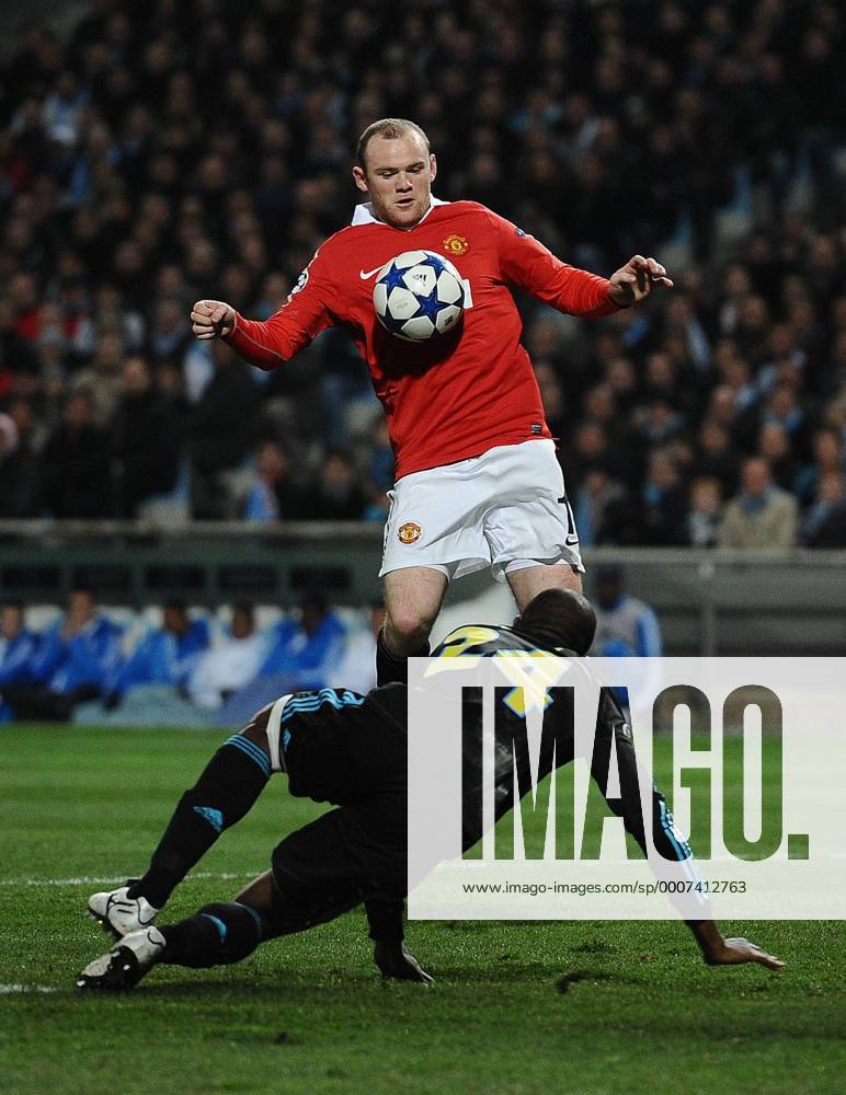 Football - Champions League Round of 16 First Leg - Olympique Marseille (blue) vs. Manchester United ManU (red) --- Wayne Rooney of Manchester United chests down the ball at the Stade Velodrome, Marseille
