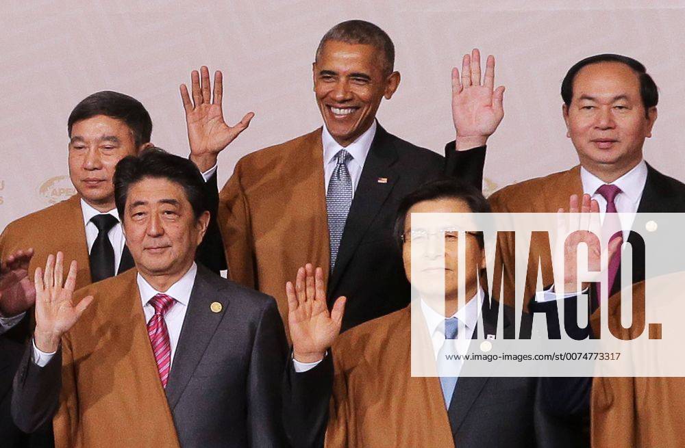 Japan s Prime Minister Shinzo Abe, South Korea s Prime Minister Hwang Kyo-ahn (L-R front), Thailand s Deputy Prime Minister Prajin Juntong, US President Barack Obama and Vietnam s President Tran Dai Quang (L-R background) pose for a group photograph at the 2016 Asia-Pacific Economic Cooperation summit. Mikhail Metzel TASS TS0383F1